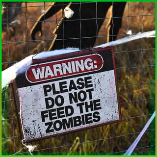 Sign that says "please do not feed the zombies"